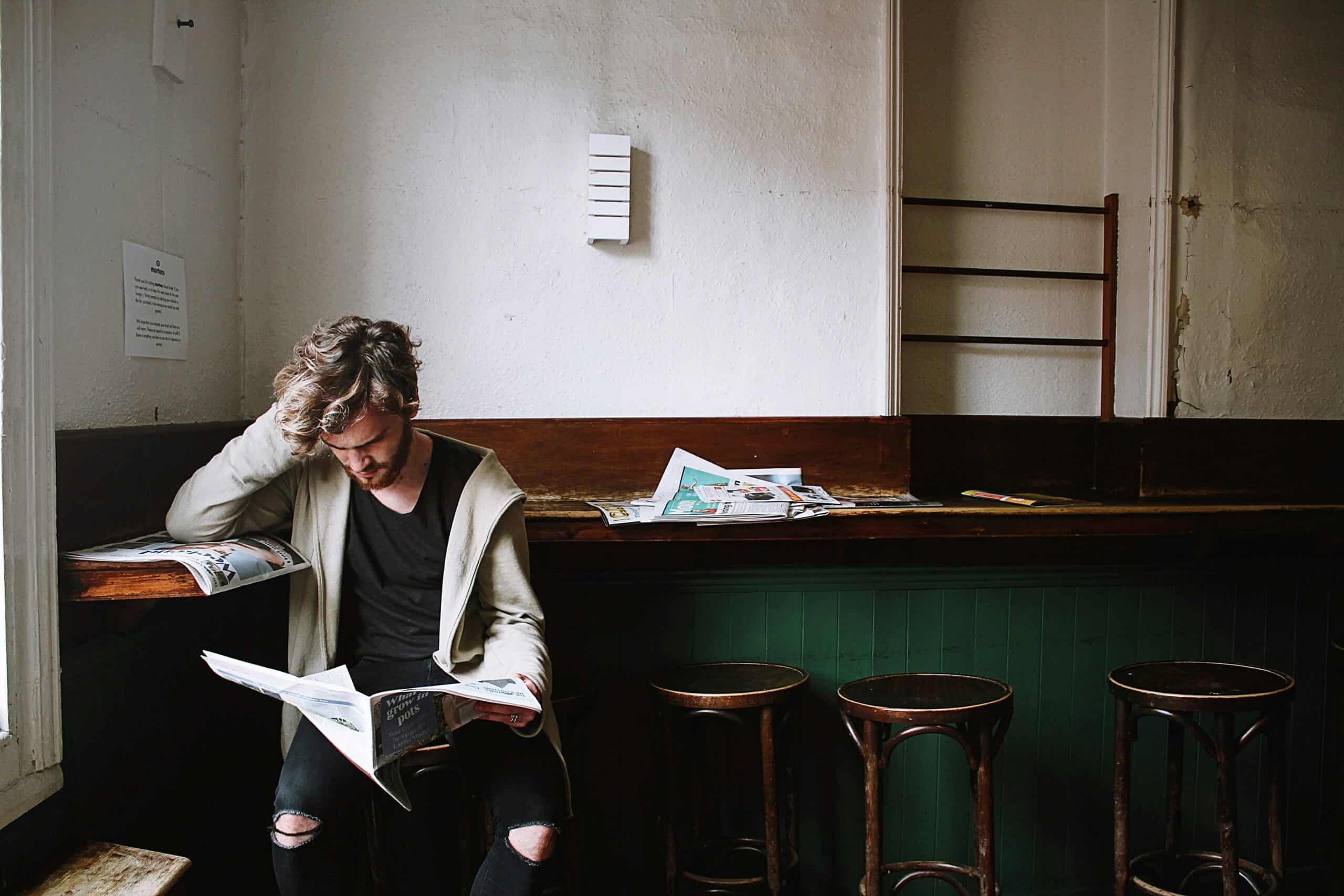 man reading newspaper